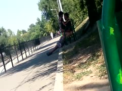 A woman is seen enjoying herself and masturbating on an outside concealed camera.